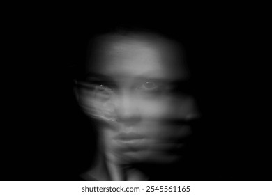 Black and white abstract portrait of a face with motion blur