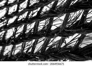 Black and white. Abstract texture and background photography of braided straw beach umbrella.