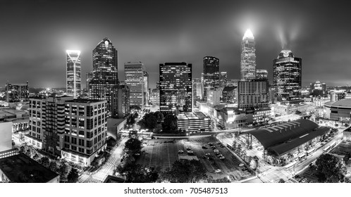 Black and white, aerial view of Charlotte, NC skyline on a foggy night. Charlotte is the largest city in the state of North Carolina and the 17th-largest city in the United States