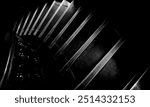 Black and white architectural abstract of old heritage stairs iin Mumbai, India showing regal, royal descending stairs and highly polished long lasting wood work. 