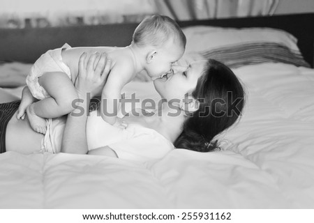 Similar – Image, Stock Photo happy mother and baby playing at home in bedroom