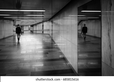 Black And White Art Photography Monochrome In Noir Style, A Man Walking The Underground Passage