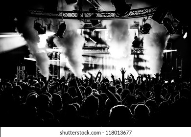 Black and White Audience Crowd Silhouette Dancing to DJ Pete Tong at Cream Nightclub Party. Nightlife Lazer Show Hands In Air With Smoke Cannon Blast