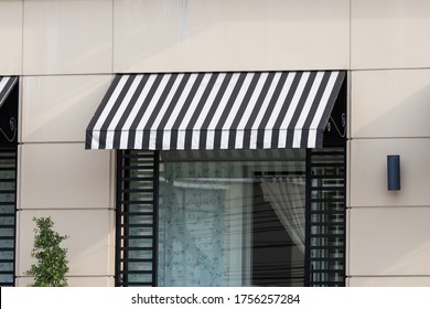 Black And White Awning Over Shop Store Window.