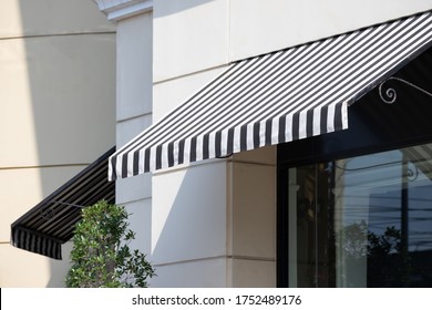 Black And White Awning Over Window Frame.