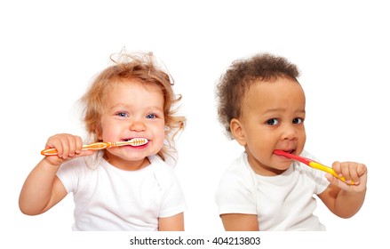 Black and white baby toddlers brushing teeth. Isolated on white background.