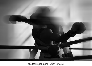 Black and white background image on the theme of boxing.  Combat sports. Silhouettes without faces. - Powered by Shutterstock