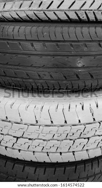 Black and white background image show surface of
car  tires.