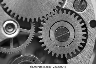 Black white background with metal cogwheels a clockwork. Conceptual photo for your successful business design. Macro.