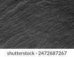 Black and white background. Black rock texture. Close-up. Stone wall backgroud for design. Copy space. Wide banner.