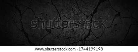 Black and white background.  Black stone texture. Old concrete wall with cracks. Web banner. Dark grunge background with copy space for design. Horror, spooky, halloween.