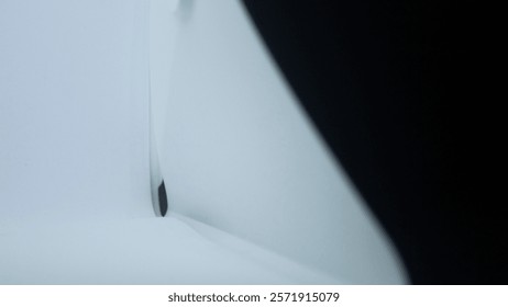 Black and white background texture created by the use of white and black papers