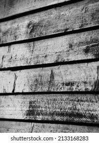 Black And White Of Barn Board On Exterior House Cabin Or Barn Wall Horizontal Lines Wood Grain And Knots On Weathered Wood Or Wooden Slats  Home Shack Exterior Paint Peeling Textured Vertical Format