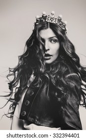 Black And White Beautiful Woman With Flying Hair In Crown In Studio