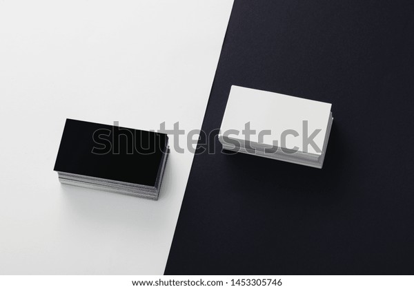 black and white blank business cards stacked\
on black and white\
background