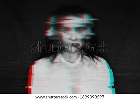 black and white blurred abstract portrait of a girl with mental disorders and schizophrenia with a glitch effect of virtual reality