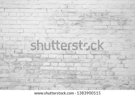 Black and white brick texture with scratches and cracks. Old vintage brick wall pattern. Brick work background.