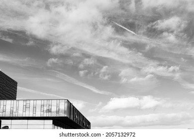 Black And White Building Architecture Detail With Sky On Background. Futuristic Architecture Background With Copyspace  And Dramatic Sky And Realistic Building