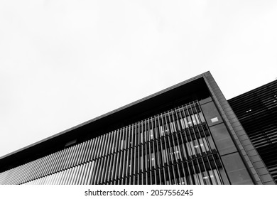 Black And White Building Architecture Detail With Sky On Background. Futuristic Architecture Background With Copyspace  And Dramatic Sky And Realistic Building