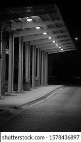 A Black And White Bust Stop At Night