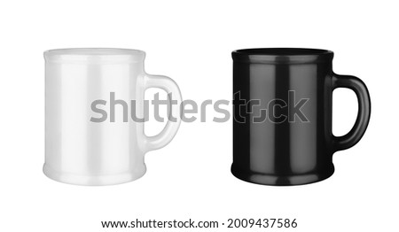 Black and white ceramic cups set white background isolated closeup, 2 mugs with handle, blank drinking glasses, beverage, ceramics, porcelain kitchen utensil, empty tea cup mockup, coffee mug template