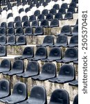 Black and White chairs at a stadium, Empty bleachers at sports stadium, minimal concept background. 