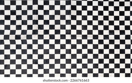 black and white checkered carpet fabric background in car and motorcycle racing concept
