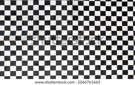 black and white checkered carpet fabric background in car and motorcycle racing concept