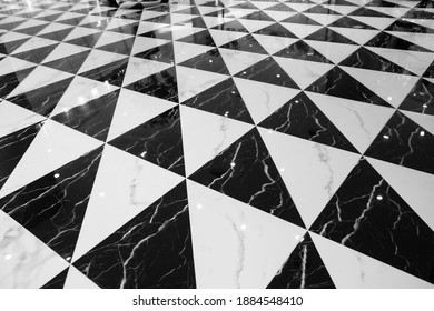 Black and white checkered marble tiles floor pattern. - Shutterstock ID 1884548410