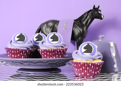 Black And White Chevron With Purple Theme Party Luncheon Table Place Setting For Melbourne Cup, Australian Public Holiday, Horse Race Event Cupcakes Against Purple Background.