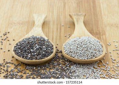 Black And White Chia Seeds On Wooden Spoon