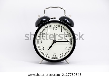 Black and white clock seven fifteen