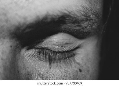 Black And White Close Up Of A Meditating Young Man With Closed Eyes