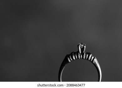 Black And White Close Up On Diamond Ring On Dark Back Drop