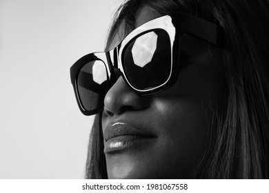 Black And White Close-up Headshot Of Black Woman, Wearing Sunglasses.