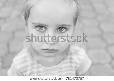 Black and white close-up portrait of young girl.