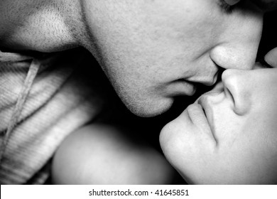 Black And White Closeup Of Woman End Man Kissing
