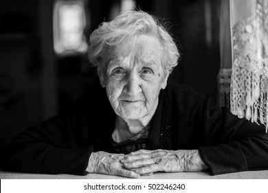 Black And White Contrast Portrait Of An Elderly Woman.