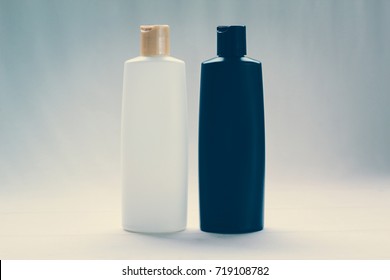 Black And White Cosmetic, Shampoo Or Perfume Bottle  On White Background With Vintage Soft Light Filter