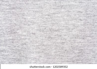 Black and white cotton fabric heather background.
Close up gray cotton fabric texture background.  
White textured knit. 
Selective focus.
top view. - Shutterstock ID 1202589352