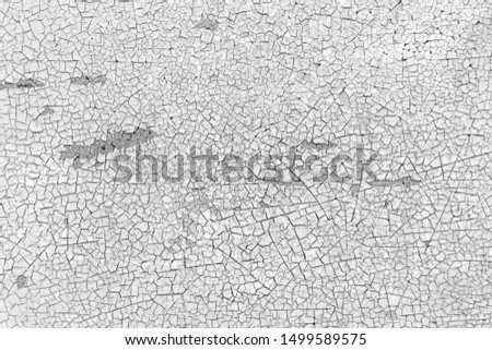 Black and white cracked on rusty iron background texture