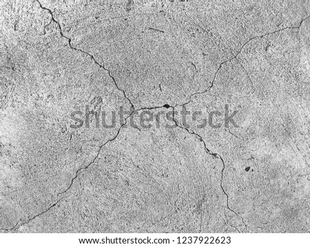 Black and white craked cement ground background and pattern