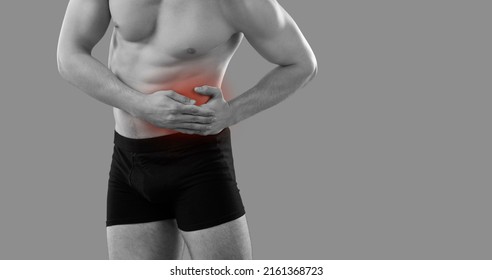 Black And White Crop Image On Sick Man In Underwear Struggle With Ache In Stomach. Pain In Belly Left Corner. Unhealthy Guy Suffer From Abdominal Painful Feeling Or Spasm. Healthcare Concept.