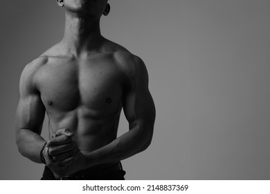 Black and white cropped picture of male perfect body isolated.