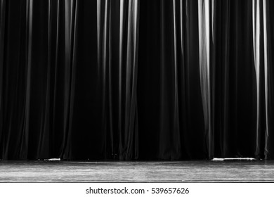 Black and white curtains and spotlight in the Theater between shows.
