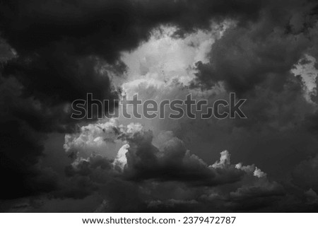 Black white dark gray dramatic night sky. Gloomy ominous storm rain clouds background. Cloudy thunderstorm hurricane wind lightning. Epic fantasy mystic. Or creepy spooky nightmare horror concept.