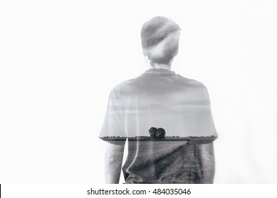 Black And White Double Exposure Of Boy Man And Landscape