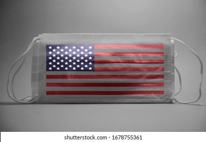 Black And White Dramatic Atmosphere With Surgical Mask With American Flag,usa Flag Text Printed On It.Impact Of Pandemic Virus To Usa.Covid -19 Spread Around USA