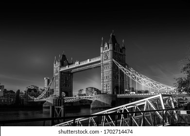 Black and white dramatic photo of the Tower Bridge in the London United Kingdom