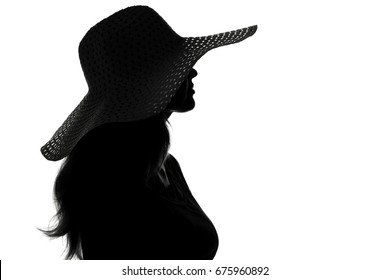 Black and white fashion portrait silhouette of a young woman in a hat with wide brim On white isolated background - Powered by Shutterstock